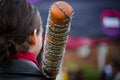 A wooden baseball bat covered in barbed wire on a man shoulder in the annual events of Zombie walk at Prince Alfred Park. Royalty Free Stock Photo